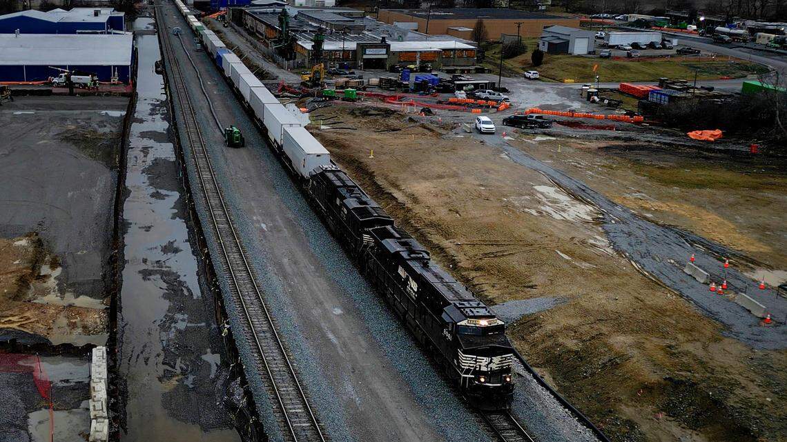In this frame grab taken from video, a Norfolk Southern train moves down the track in East Palestine, Ohio, on Monday, Jan. 29, 2024, as cleanup continues. Daily life largely returned to normal for residents of East Palestine, Ohio, months after a Norfolk Southern train derailed and spilled a cocktail of hazardous chemicals that caught fire a year ago, but the worries and fears are always there. (AP Photo/Carolyn Kaster)