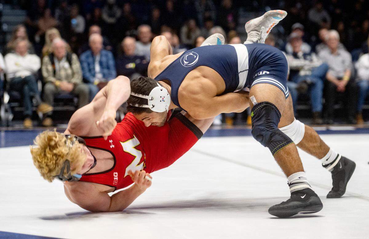 Penn State’s Shayne Van Ness controls Maryland’s Ethen Miller in the 149 lb bout of the match on Sunday, Feb. 12, 2023 at Rec Hall.