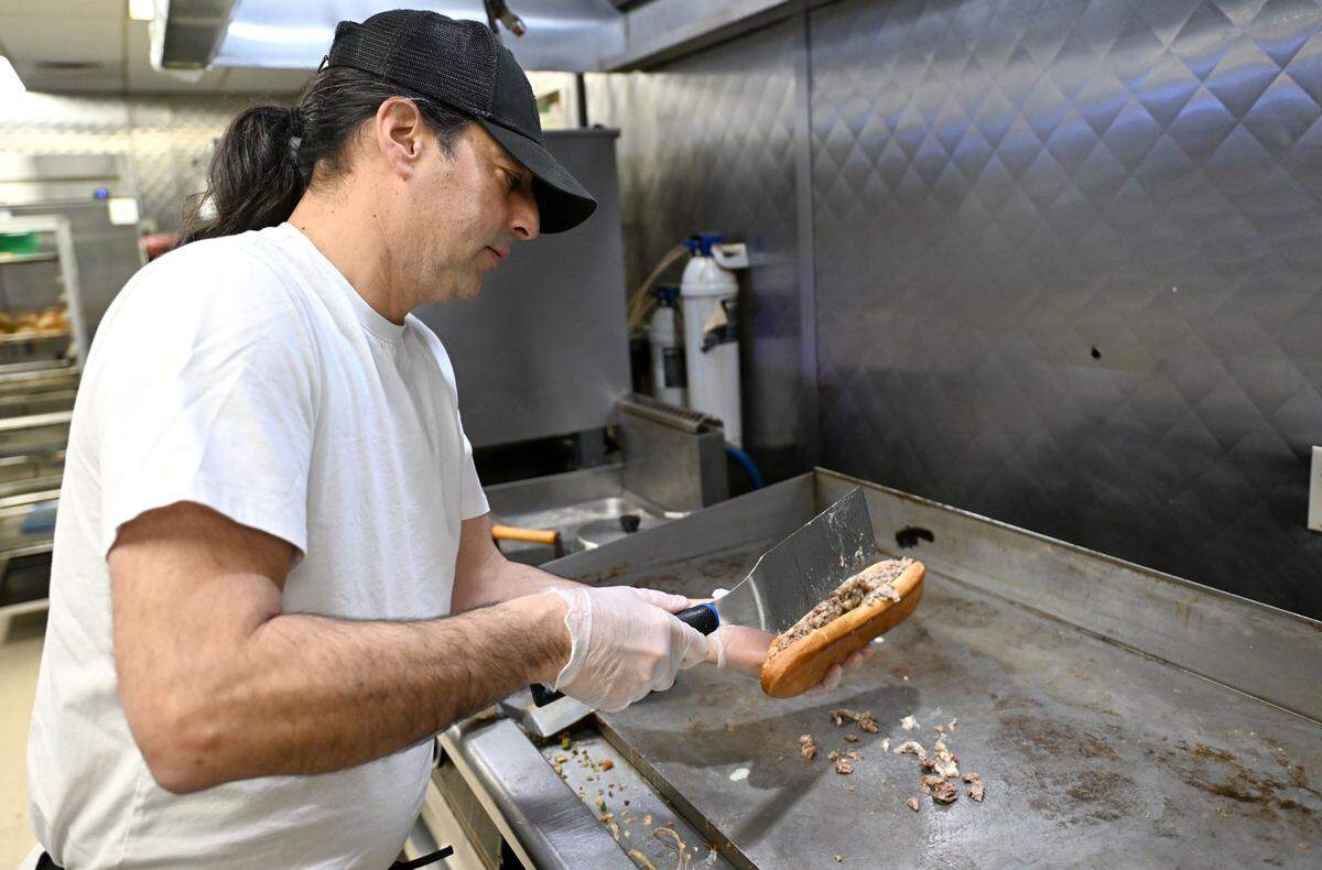 Eddie Agostinelli of Pasti Bella makes a Gorgonzola cheesesteak on Wednesday, Jan. 7, 2026, at McLanahan’s Downtown Market. The sandwich features beef, American cheese, a house-made Gorgonzola sauce and pecorino Romano cheese.