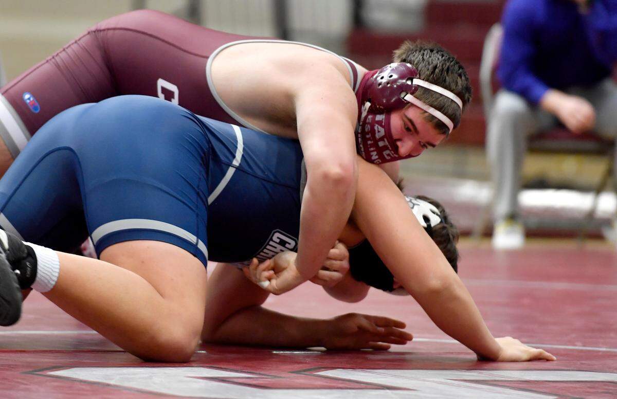 State College’s Harrison Schoen controls Chambersburg’s Avery Kuhns in the 285 lb bout during the match on Monday, Feb. 8, 2021. Schoen won by fall.