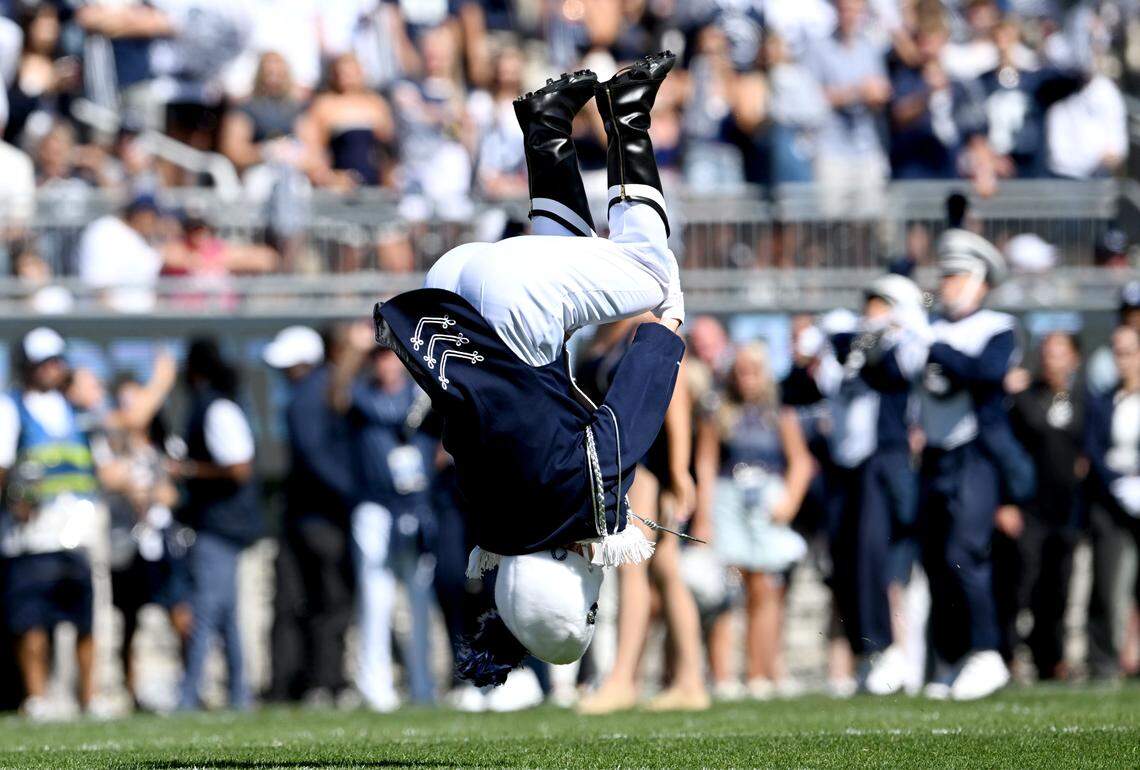 Penn State Blue Band drum major Ellie Sheehan does the first flip of the pregame show on Saturday, Aug. 30, 2025.  