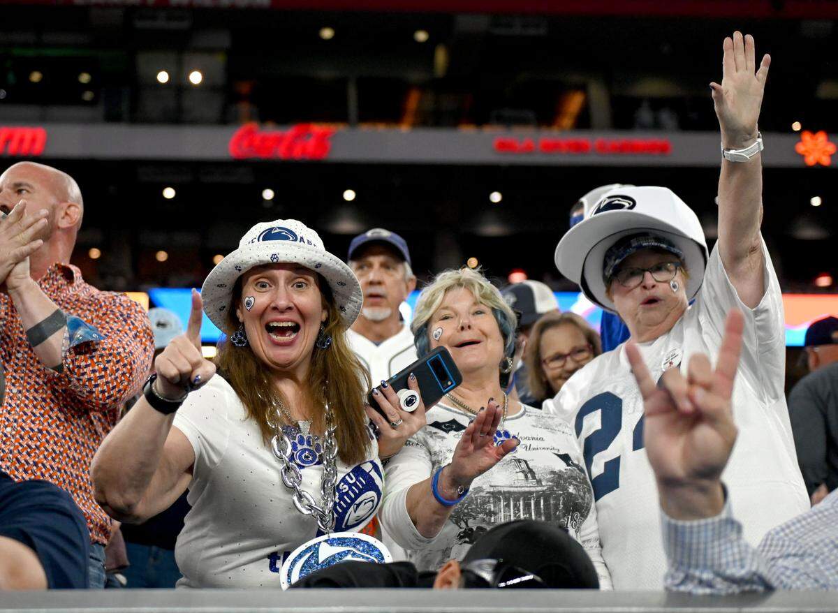 Penn State fans cheer as the team warms up for the Fiesta Bowl against Boise State at State Farm Stadium on Tuesday, Dec. 31, 2024.