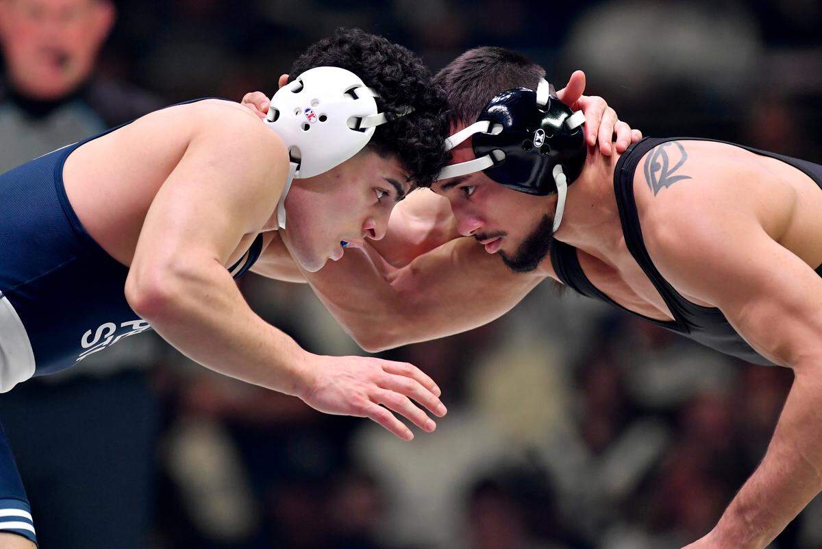Penn State’s Beau Bartlett wrestles Iowa’s Real woods in the 141 lb bout of the match on Friday, Jan. 27, 2023.