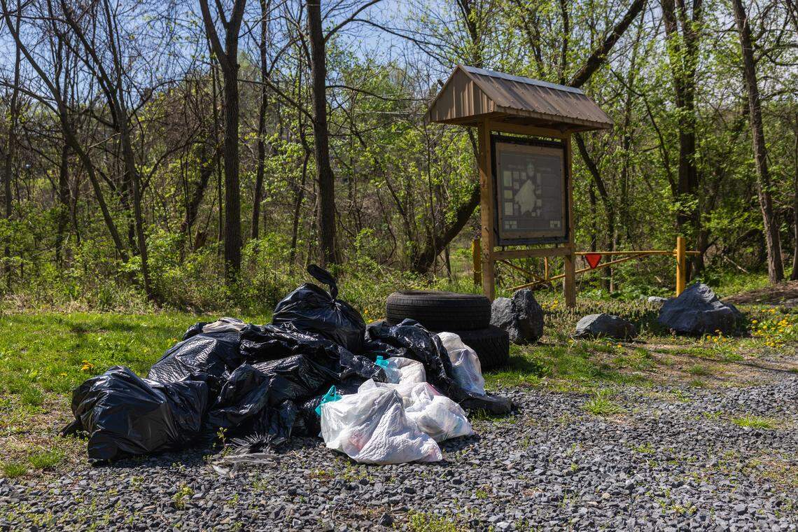 Trash bags are piled along Roopsburg Road in Bellefonte, Pa., on Saturday, April 18, 2026. The ClearWater Conservancy organized volunteers across Centre County to clean up public green spaces.