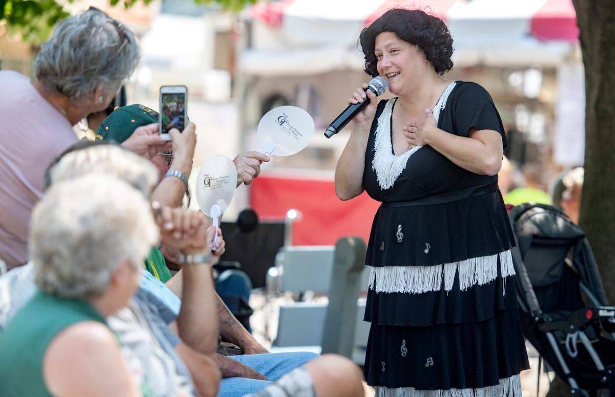 Patsy Cline tribute artist Heather Olsen serenades visitors in Jubilee Grove at the Centre County Grange Fair on Tuesday.