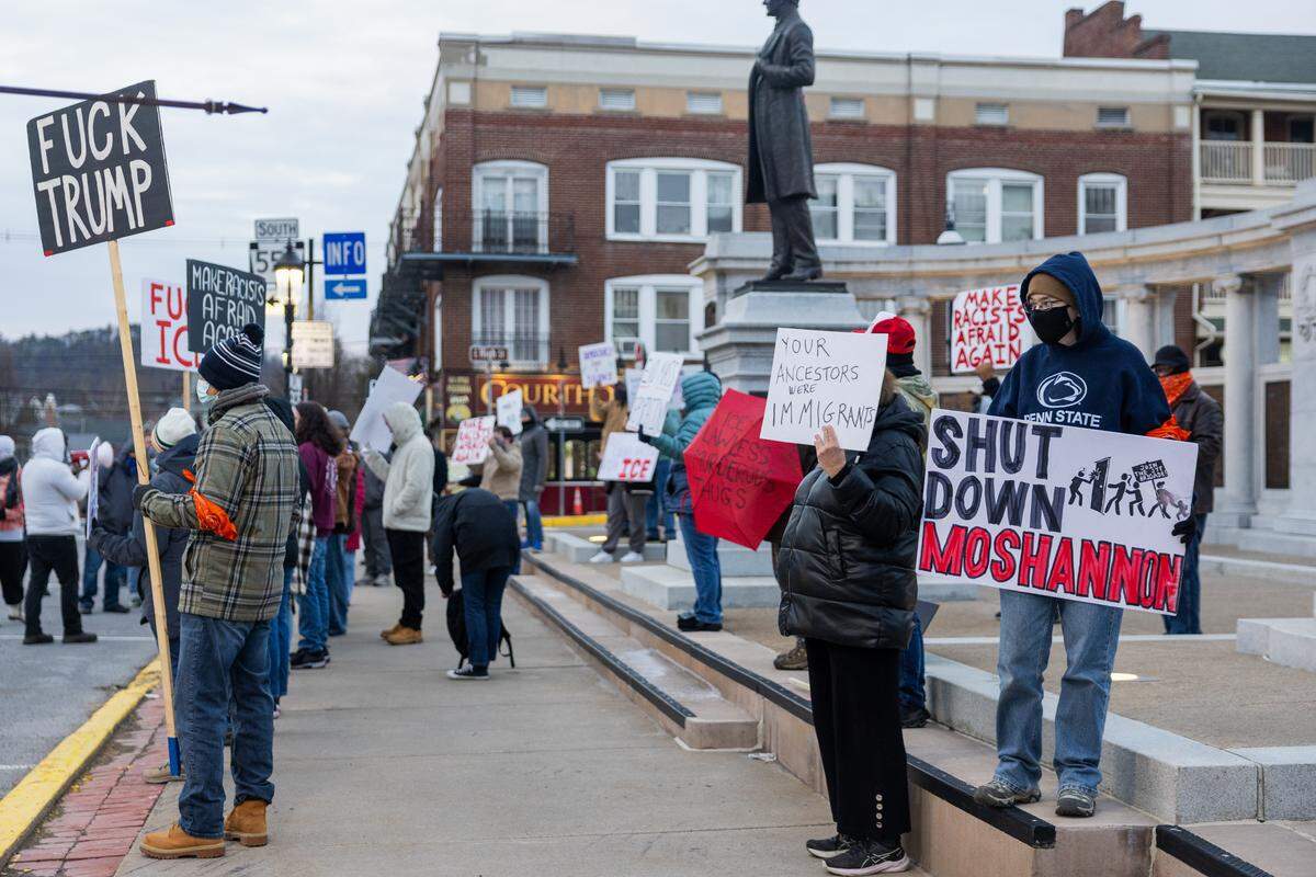 Community members protest in front of the Centre Country Courthouse in Bellefonte on Wednesday, March 18, 2026. 