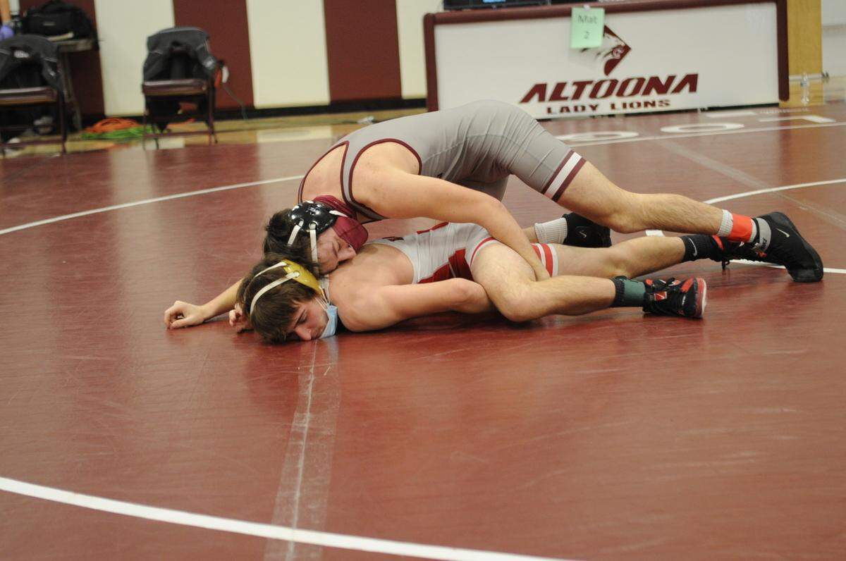 State College’s Kyle Martin, top, is tied for the county lead with two major decision wins so far this year. He earned two on Saturday with one coming over Bellefonte’s Dylan Dann, 9-1.