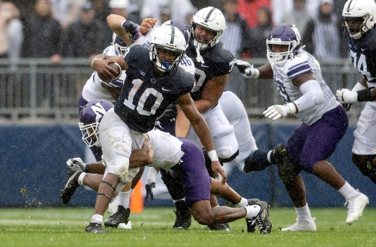 Penn State running back Nick Singleton tries to cut through Northwestern defenders during the game on Saturday, Oct. 1, 2022.
