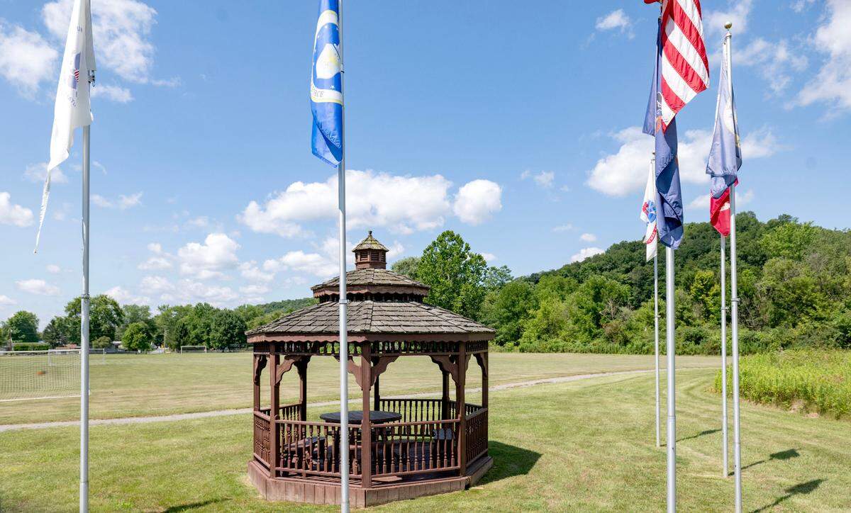 Flags along the walking trail at the Unionville Borough Park on Friday, July 19, 2024.