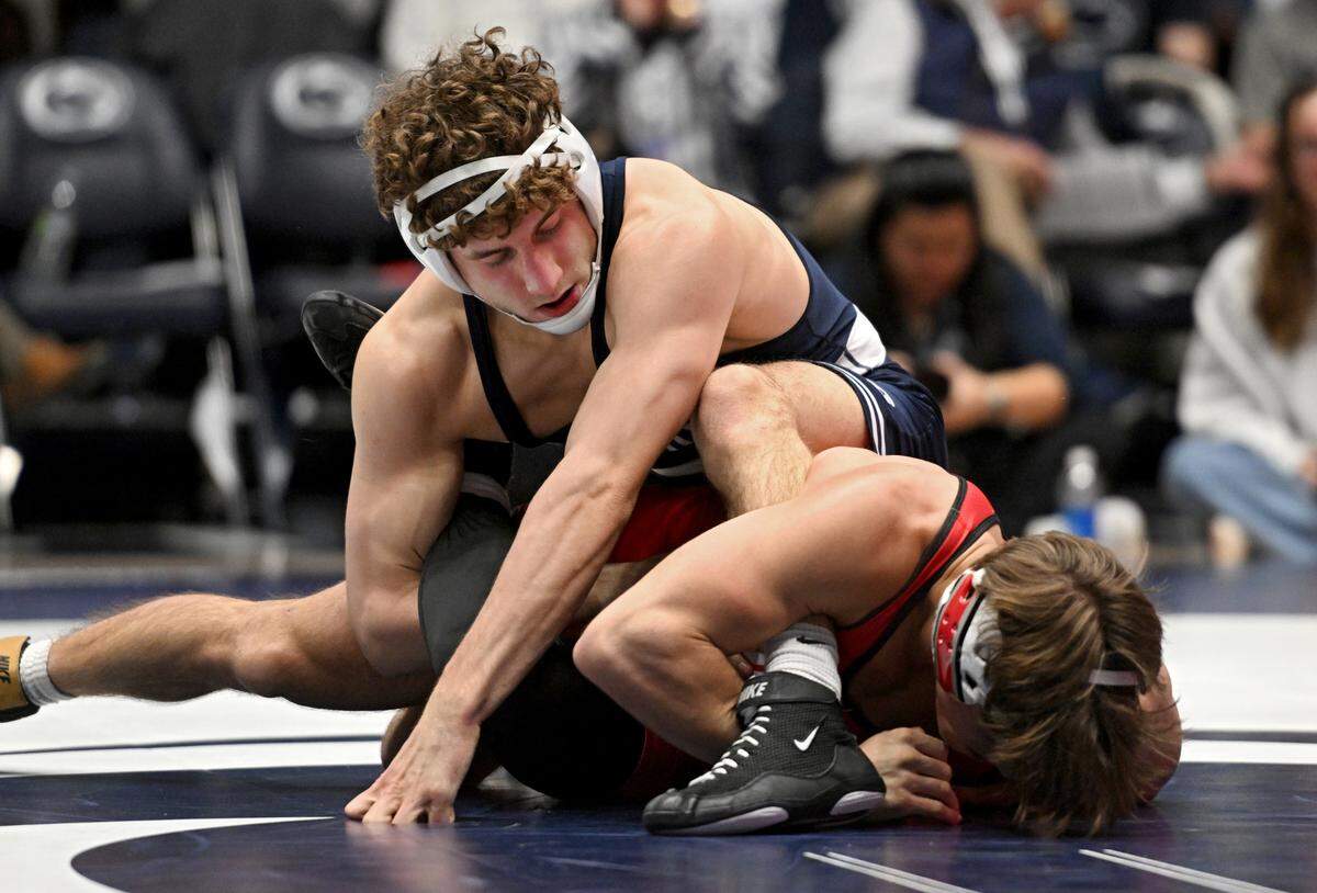 Penn State’s Mitchell Mesenbrink wrestles Ohio State’s Bryce Hepner in the 165 lb bout during the match on Friday, Feb. 2, 2024 in Rec Hall.
