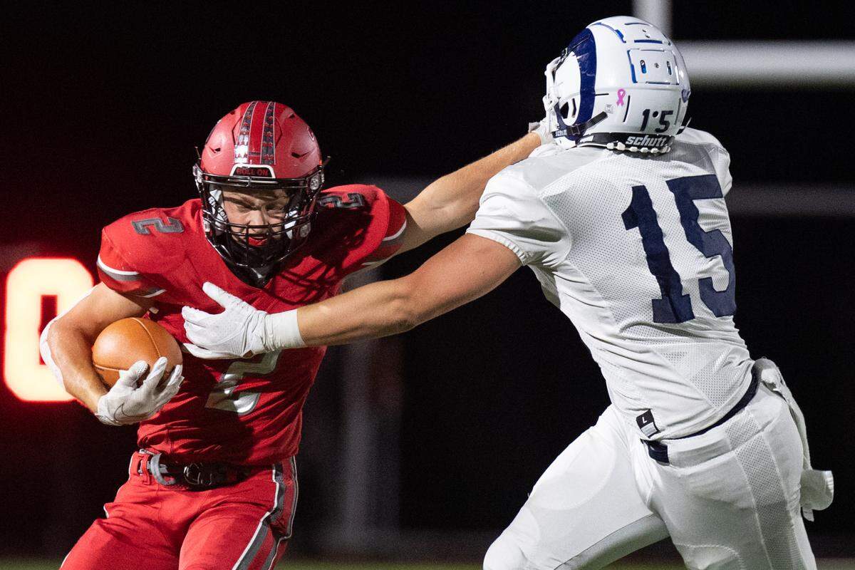 Nick Capparelle (2) stiff arms Mason Lieb (15) during Bellefonte Area High School’s game against Penns Valley Area High School on Friday, Oct. 2, 2020 in Bellefonte, Pa.