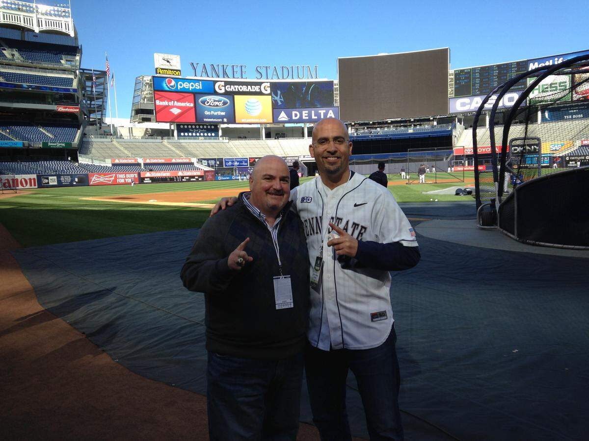 Mike Santella, left,  and James Franklin on the field at Yankee Stadium.