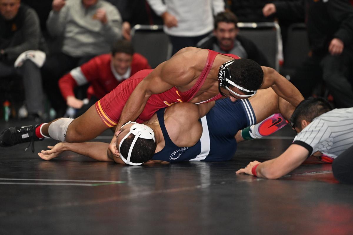 Penn State’s Aaron Brooks attempts to fight from being pinned by Iowa State’s Marcus Coleman in their 184-pound bout of the Nittany Lions’ 22-12 win on Tuesday, Dec. 20, 2022. Coleman topped Brooks, 9-7.