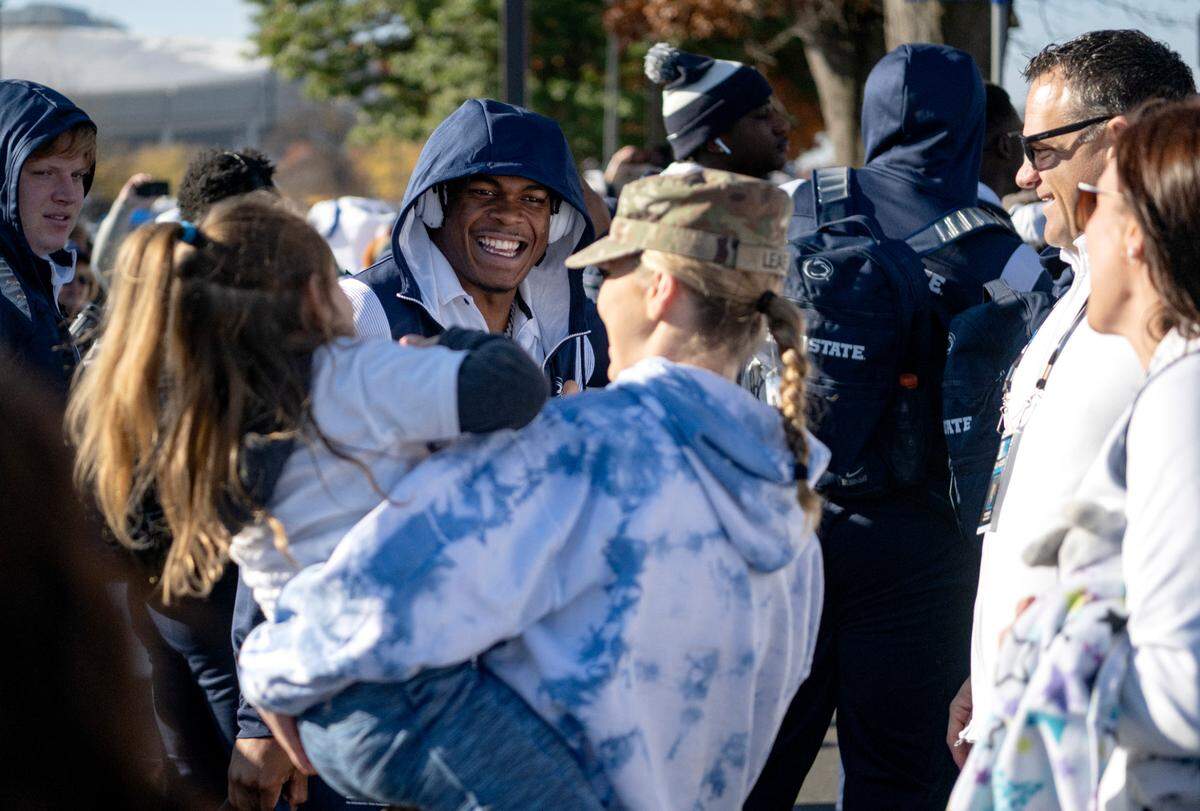 Penn State safety Ji’Ayir Brown smiles with fans as he and the team arrive at Beaver Stadium for the game against Ohio State on Saturday, Oct. 29, 2022.