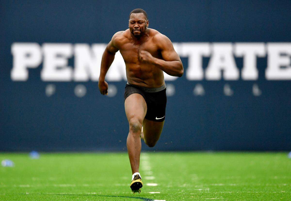 Defensive end Arnold Ebiketie runs the 40 yard dash during Penn State pro day on Thursday, March 24, 2022.