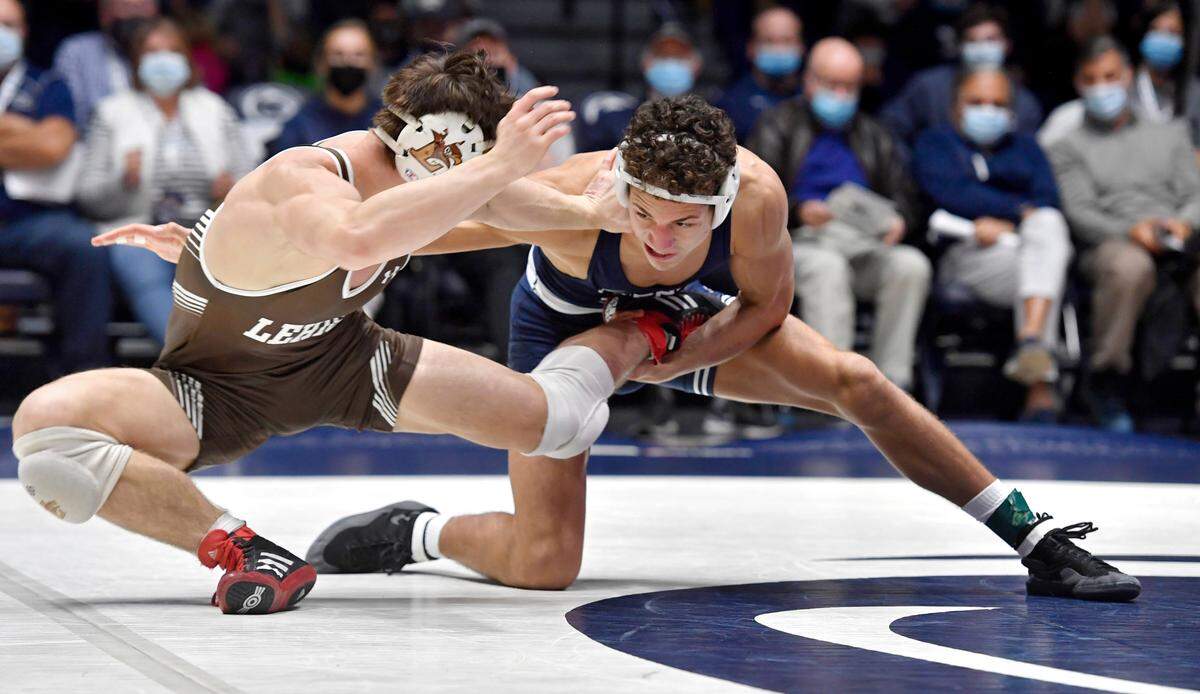 Penn State’s Tony Negron reaches for Lehigh’s Josh Humphreys in the 157 lb bout during the match on Sunday, Dec. 5, 2021 at Rec Hall. Penn State won, 23-16.
