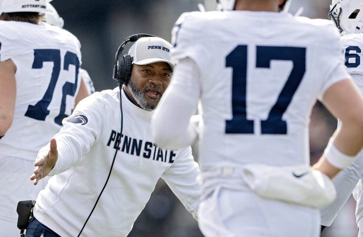 Penn State interim coach Terry Smith congratulates players after a touchdown during the game against Ohio State on Saturday, Nov. 1, 2025.