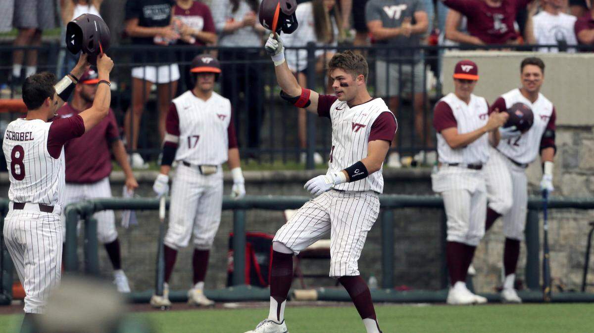 Virginia Tech’s Jack Hurley, center, celebrates a home run in the seventh inning against Oklahoma during an NCAA college baseball tournament super regional game Friday, June 10, 2022, Blacksburg, Va.