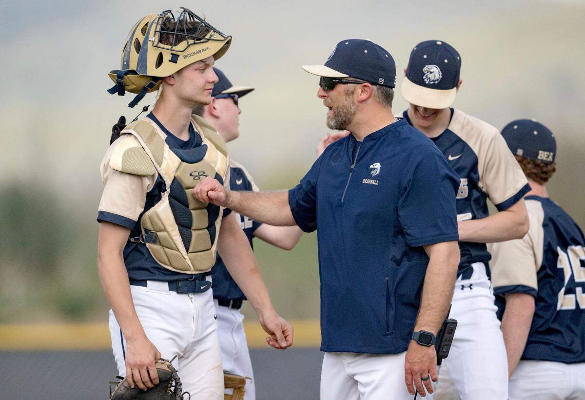 Bald Eagle Area baseball coach Ryan MacNamara talks to catcher Hayden Stimer during the game against Bishop Carroll on Tuesday, April 29, 2025.