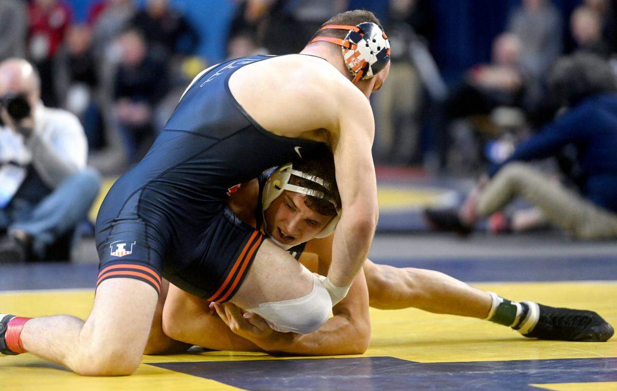 Penn State’s Alex Facundo wrestles Illinois’ Dan Braunagel in the165 lb bout for seventh place at the Big Ten wrestling championships at the Crisler Center on Sunday, March 5, 2023.