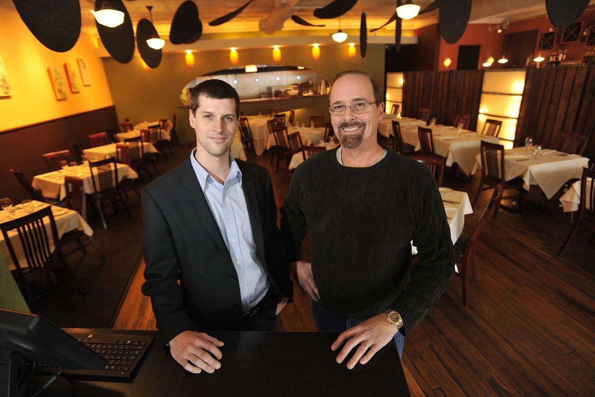 Zola Kitchen and Wine Bar, co-owned by Andrew Hufnagel, left, and his father Robert Hufnagel, will close Aug. 25.