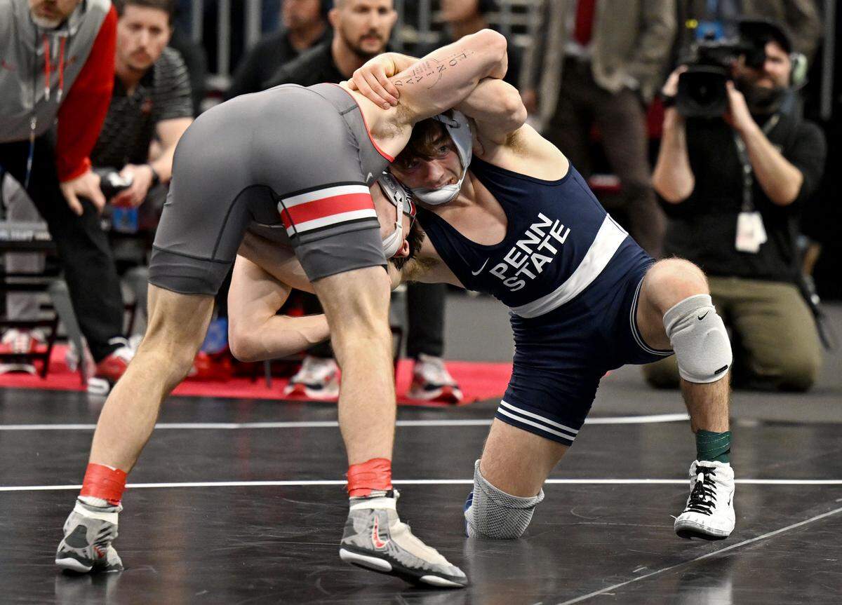 Ohio States’ Ben Davino and Penn State's Marcus Blaze wrestls in a 133-pound semifinal bout of the NCAA wrestling championships on Friday, March 20, 2026.  