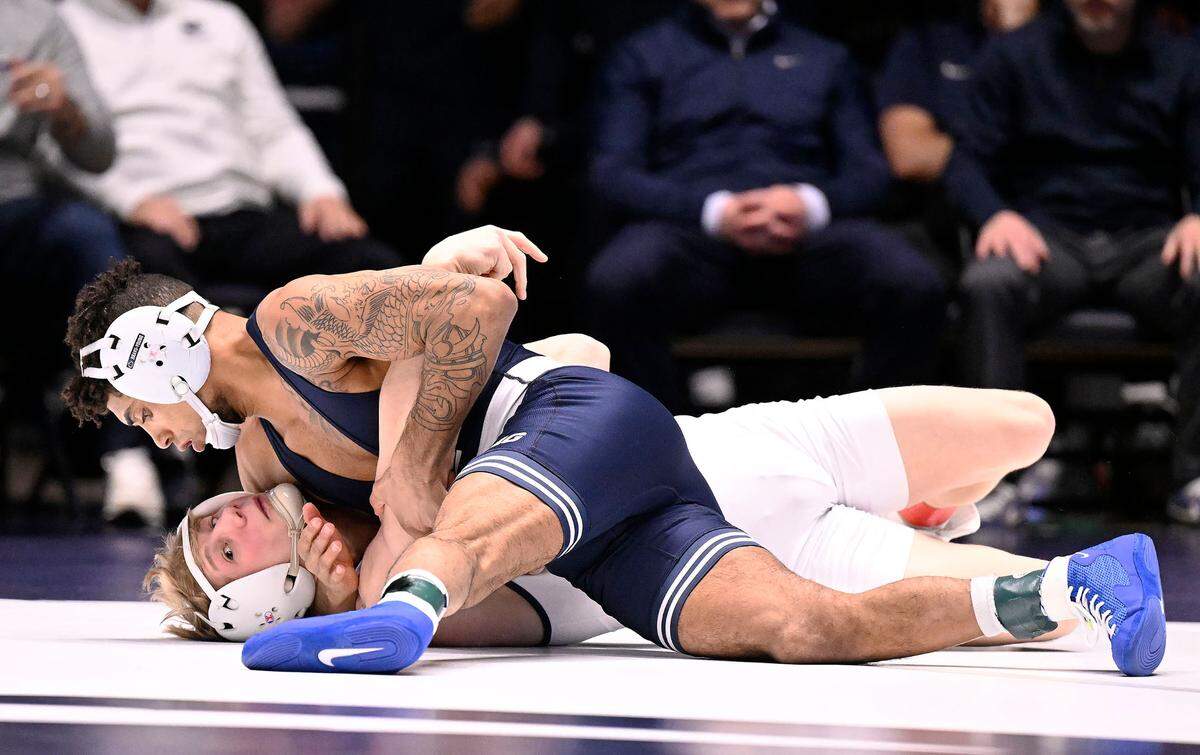Penn State’s Roman Bravo-Young (top) scores one of several takedowns for a near fall before eventually pinning Clarion’s Mason Prinkey at 133 pounds Sunday, Feb. 19, 2023, at Rec Hall.