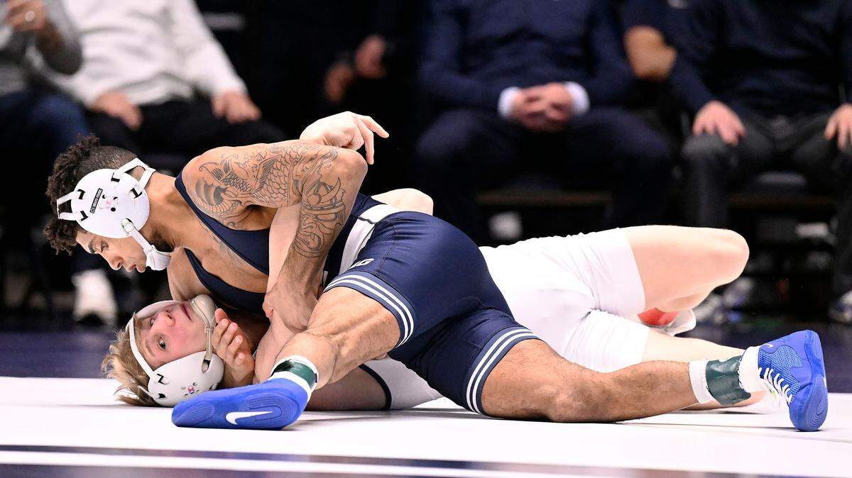 Penn State’s Roman Bravo-Young (top) scores one of several takedowns for a near fall before eventually pinning Clarion’s Mason Prinkey at 133 pounds Sunday, Feb. 19, 2023, at Rec Hall. Penn State defeated Clarion 40-6.