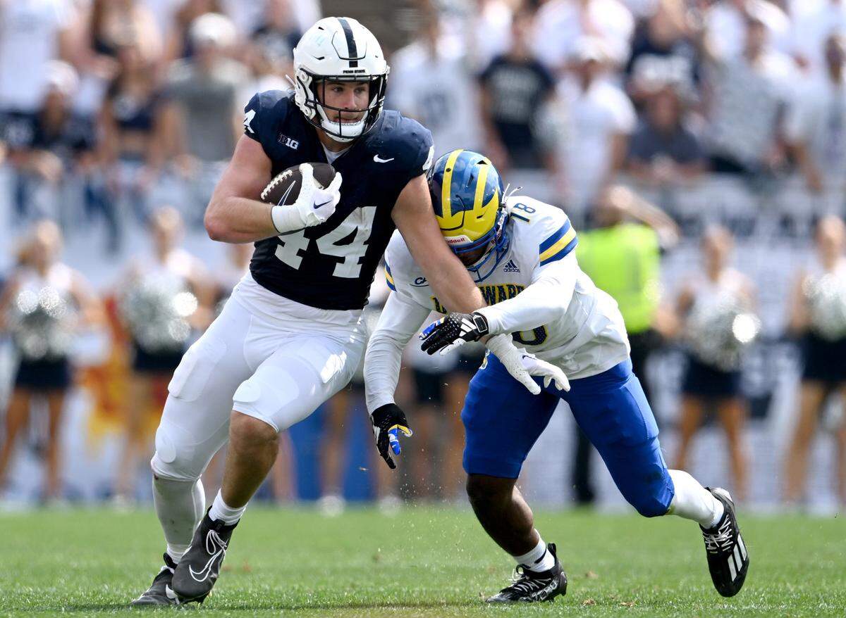 Penn State tight end Tyler Warren makes a catch and cuts down the field with the bal around Delaware’s Christian Pierce during the game on Saturday, Sept. 9, 2023.