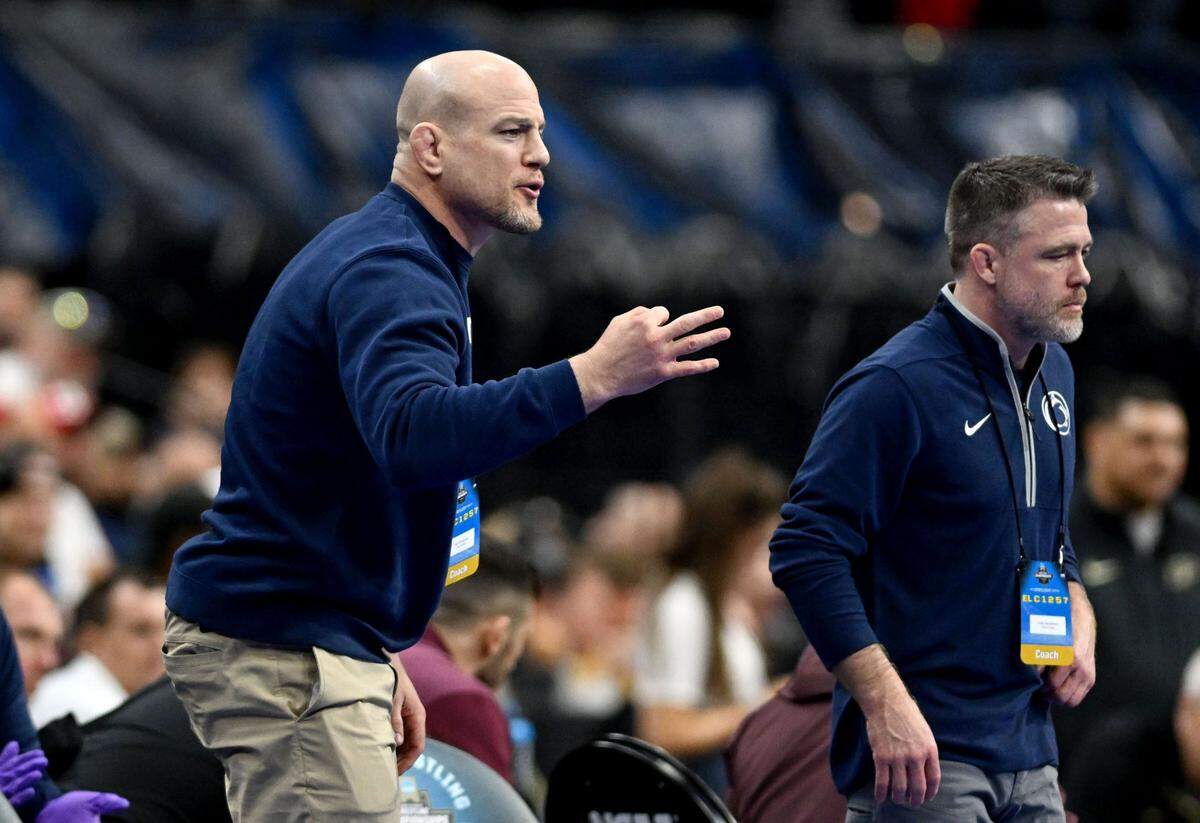 Penn State wrestling coach Cael Sanderson yells for a takedown during Tyler Kasak bout against Iowa State’s Cody Chittum during the 2025 NCAA Wrestling Championships in Philadelphia on Thursday, March 20, 2025.
