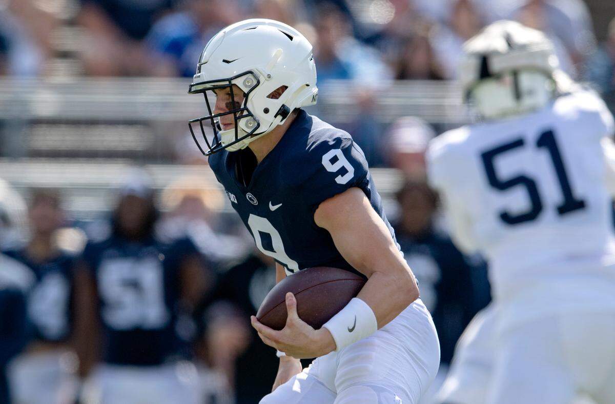 Penn State quarterback Beau Pribula runs with the ball during the Blue-White game on Saturday, April 23, 2022.