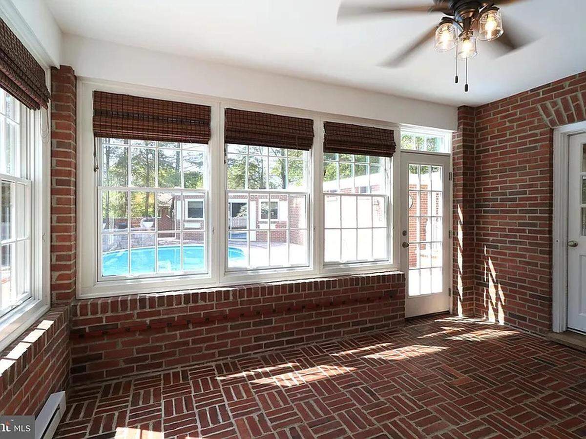 A covered brick sunroom is one of the features of a new listing at 505 Hillcrest Ave. in State College, on the market as of the beginning of June.
