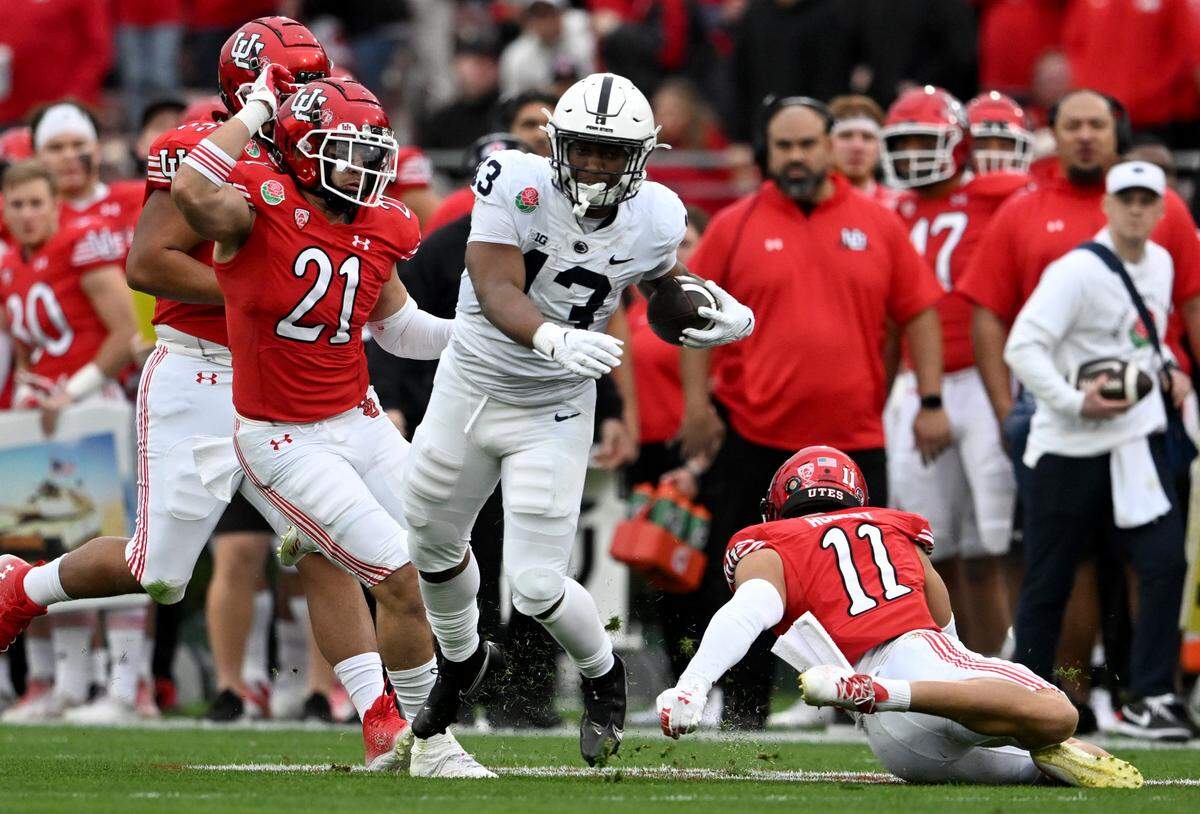 Penn State running back Kaytron Allen cuts down the field with the ball from Utah defenders during the Rose Bowl game on Monday, Jan. 2, 2023.