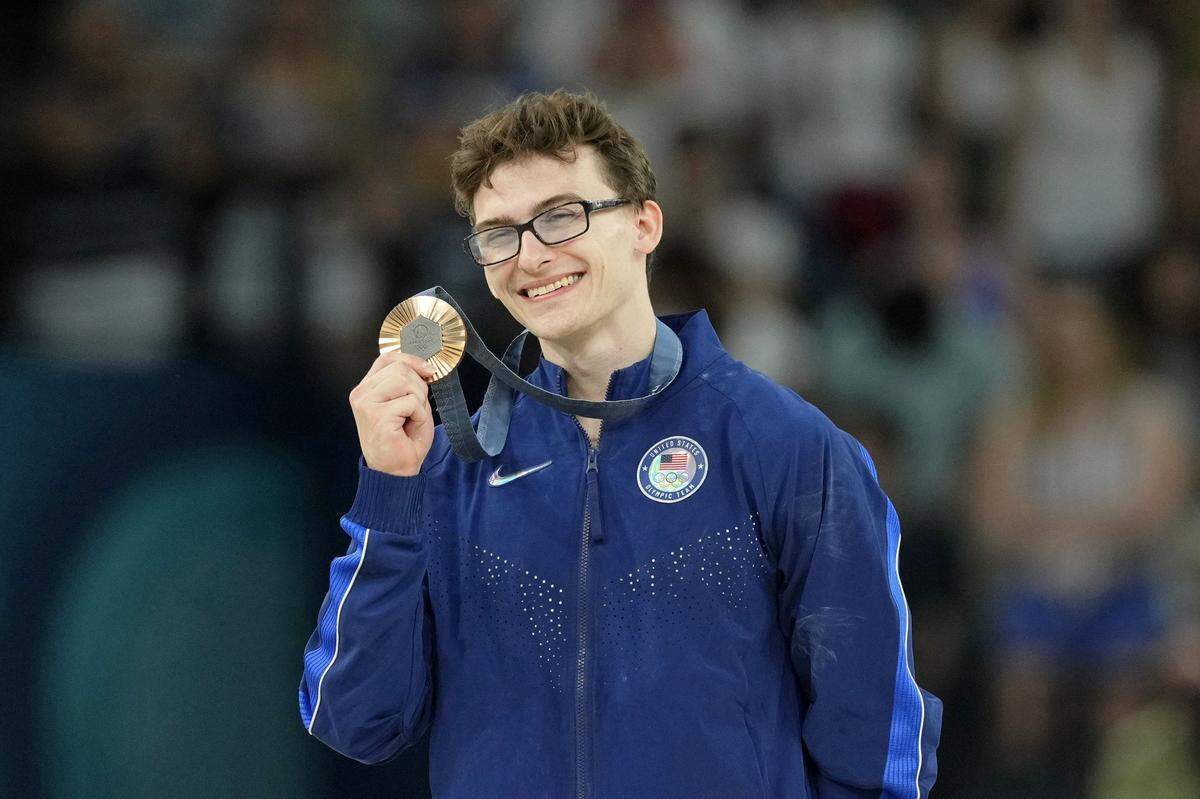 Aug 3, 2024; Paris, France; Stephen Nedoroscik of the United States poses for a photo with his bronze medal on the pommel horse on the first day of gymnastics event finals during the Paris 2024 Olympic Summer Games at Bercy Arena. Mandatory Credit: Kyle Terada-USA TODAY Sports