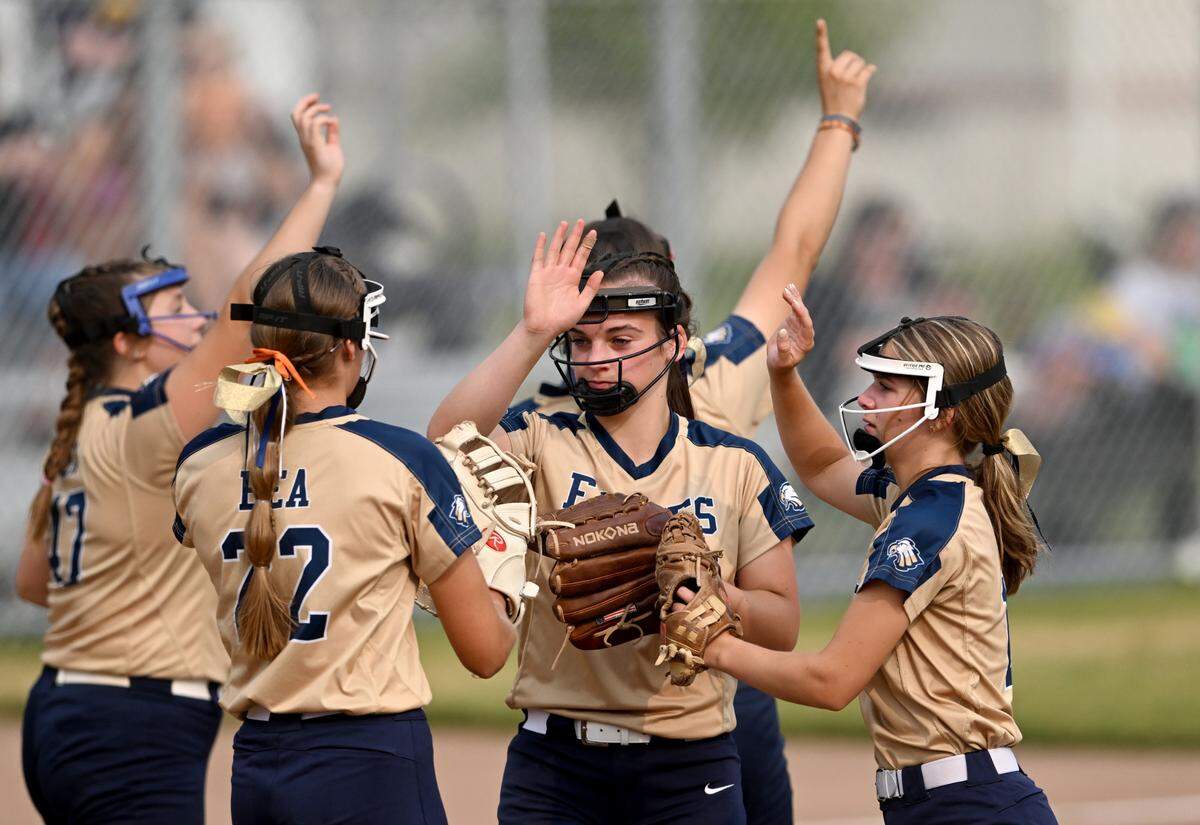 Bald Eagle Area’s Sierra Albright high-fives the infielders after a strikeout during the game against Muncy in the first round of the PIAA class 2A softball playoffs on Monday, June 5, 2023.