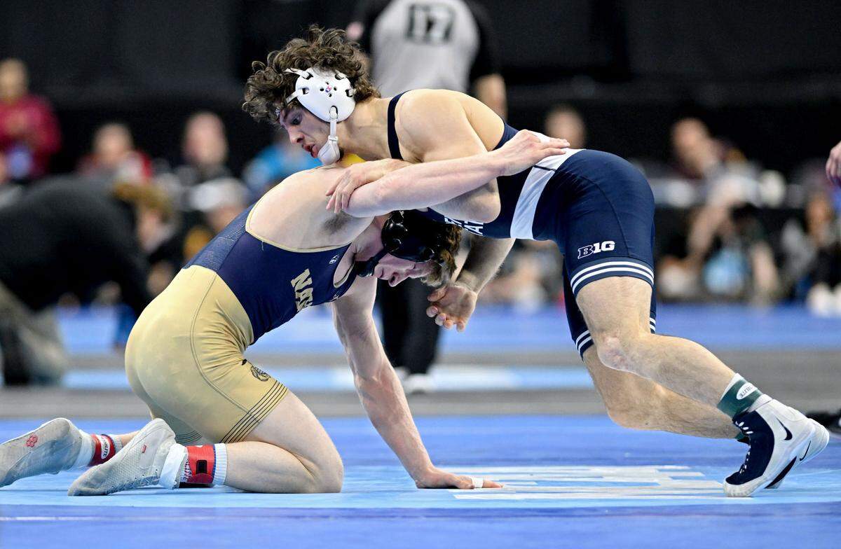 Penn State’s Levi Haines wrestles Navy’s Danny Wask in a 174-pound quarterfinal bout during the 2025 NCAA Wrestling Championships in Philadelphia on Friday, March 21, 2025.