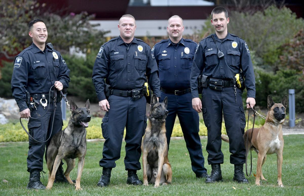 Penn State Police Officer Phil Peng and K-9 Roni, Officer Josh Quimby and K-9 Wail, University Police Lt. Matt White, and Officer Dustin Miller with K-9 Rudie.