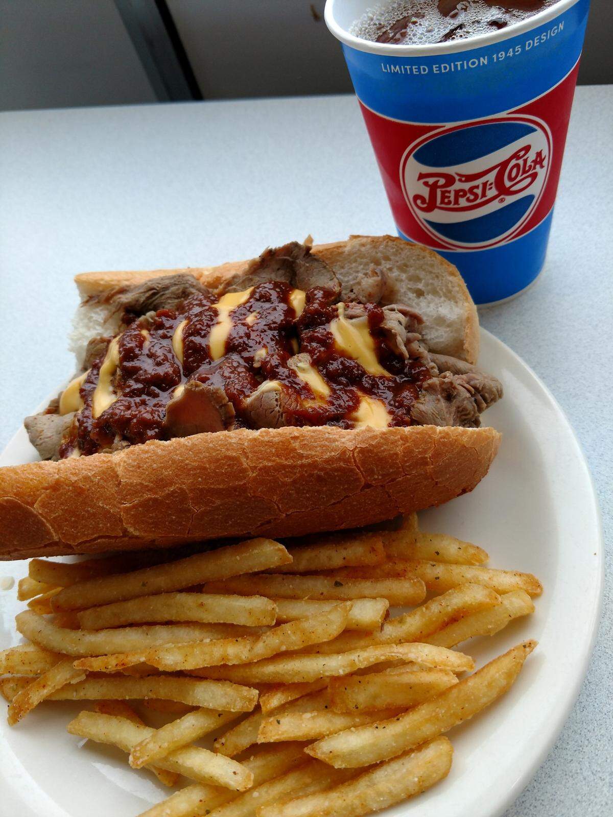 The Line Backer, slow roasted top round of beef served on a warm sub roll with cheese and red zone sauces, is one of the sandwiches that the Rolling Lion Truck will serve.