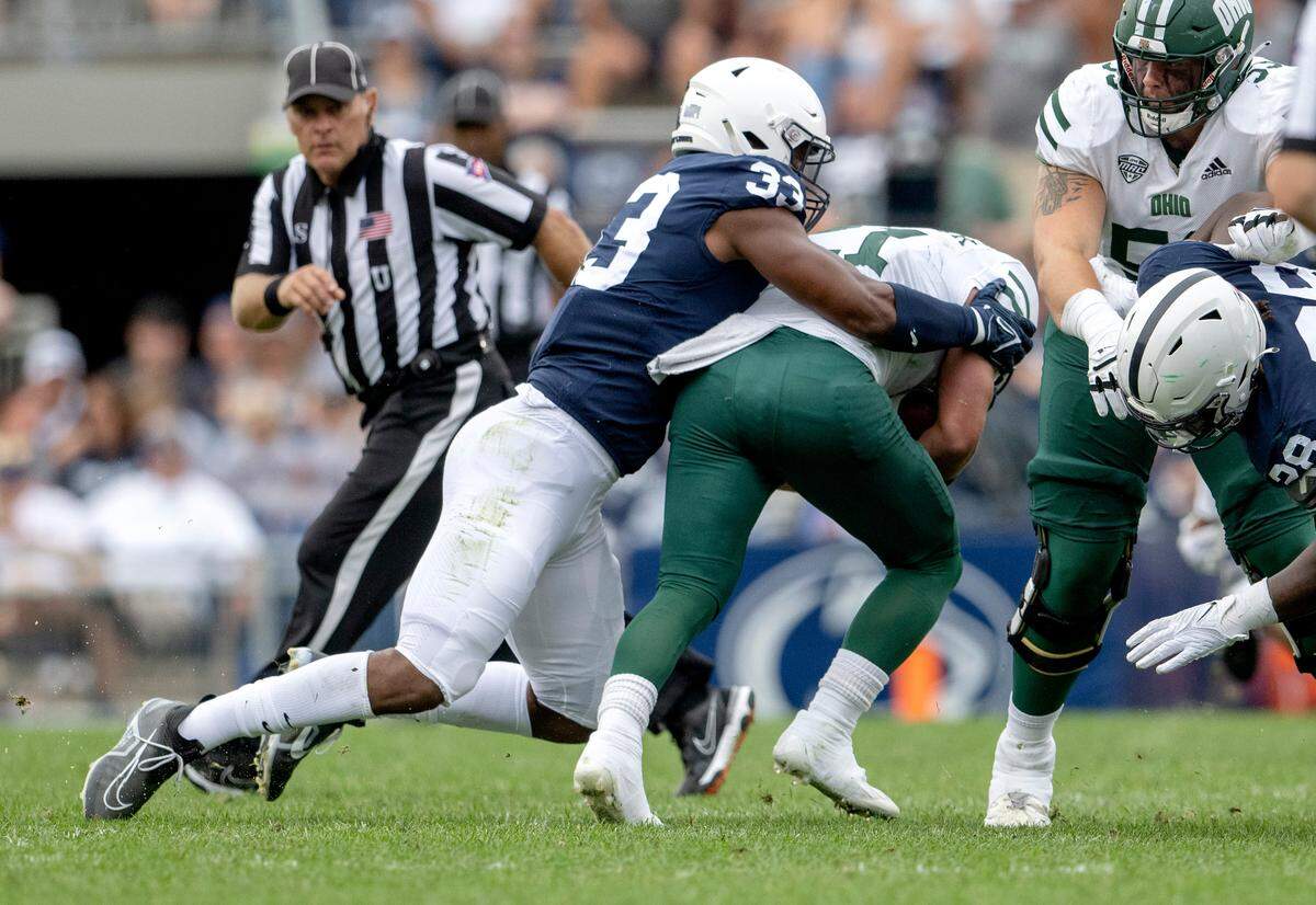 Penn state defensive end Dani Dennis-Sutton stops Ohio’s ball carrier during the game on Saturday, Sept. 10, 2022.