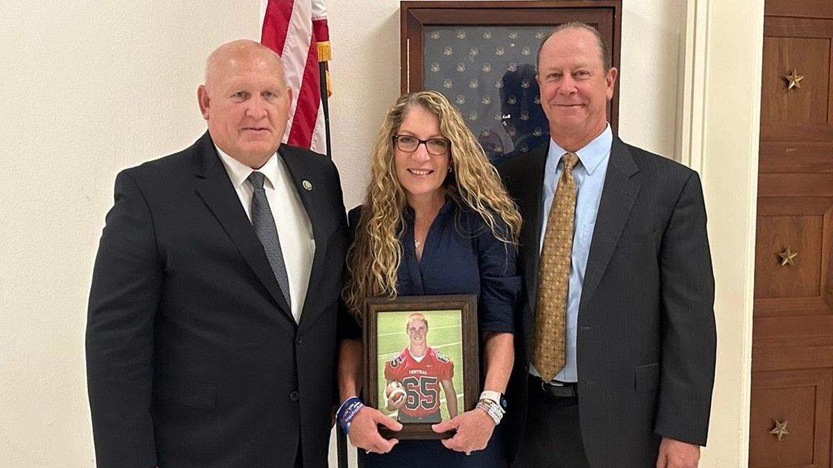 U.S. Rep. Glenn Thompson, left, R-Howard, poses next to Evelyn and Jim Piazza, who are holding a picture of their son Tim. Timothy J. Piazza died in 2017, at the age of 19, after being hazed at a Penn State fraternity. All three have advocated for the passage of the Stop Campus Hazing Act, which advanced past a U.S. House committee Wednesday.
