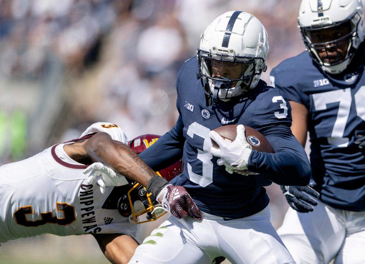 Central Michigan’s Trey Jones dives for Penn State wide receiver Parker Washington during the game on Saturday, Sept. 24, 2022.