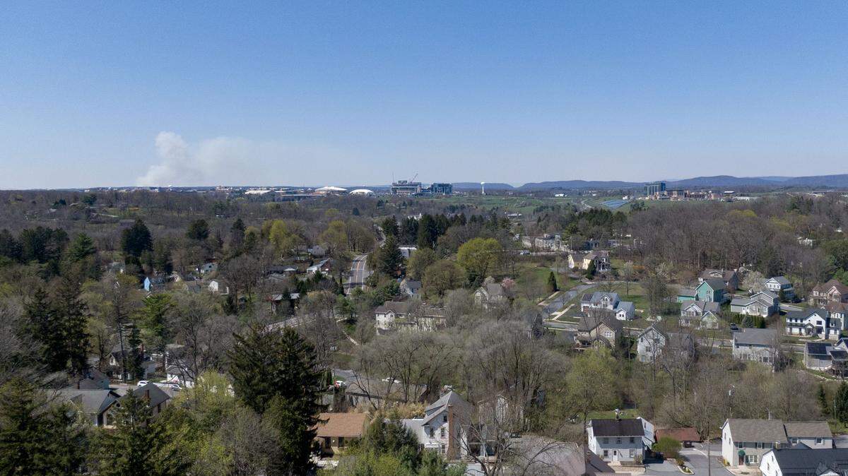 Smoke can be seen on the horizon from a prescribed burn in their aerial photo taken over Lemont on Wednesday, April 8, 2026.  