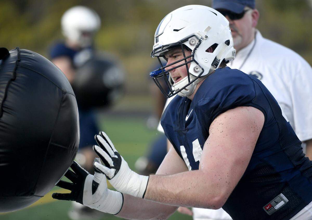 Penn State offensive lineman Will Fries runs a drill at practice on Sunday, Dec. 30, 2018 at Celebration High School. For the last practice of the season players traded jerseys with a teammate.