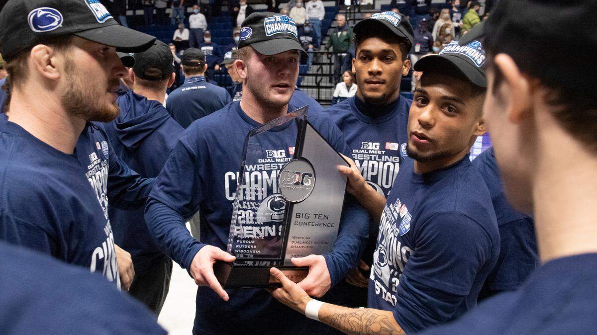 Roman Bravo-Young holds the Big Ten Regular Season Dual Meet Championship trophy on Feb. 6 after a dual between No. 1 Penn State and No. 8 Nebraska at Rec Hall.