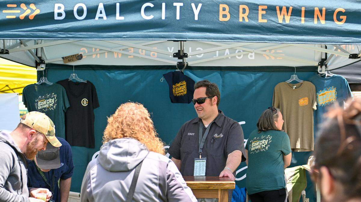 Mike Smith, brewmaster at Boal City Brewing, prepares to serve attendees at the 2024 Hoppy Valley Brewers Fest at Penn State’s Beaver Stadium.