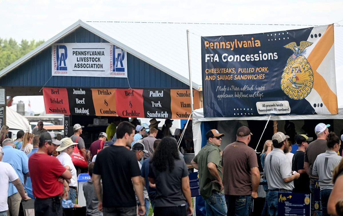 Visitors line up for lunch from the Pennsylvania FFA concessions and the Pennsylvania Livestock Association at Penn State’s Ag Progress Days on Tuesday, August. 13, 2024.