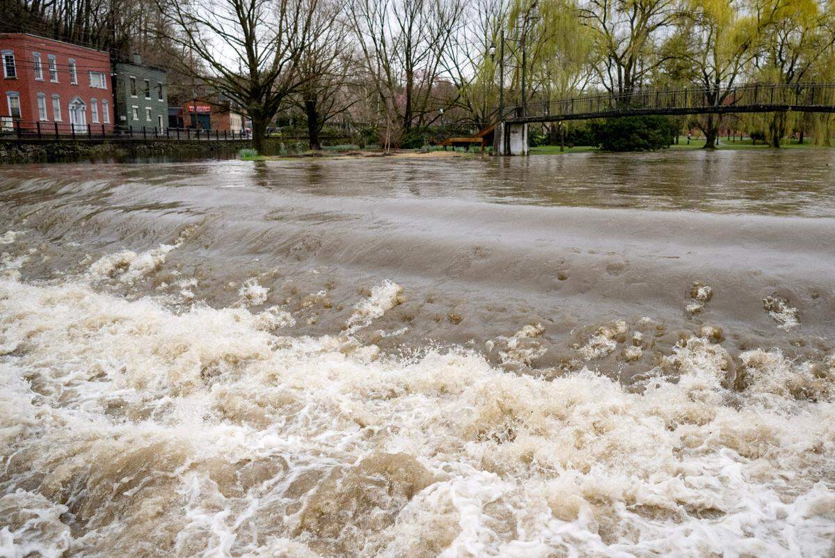 Water rushes through Talleyrand Park on Wednesday, April 3, 2024.