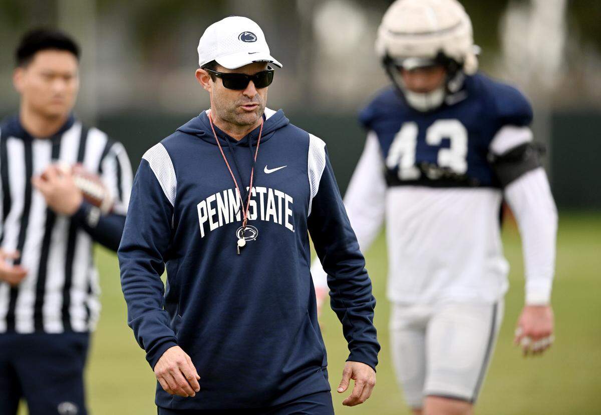 Penn State defensive coordinator Manny Diaz talks to a group of players during practice for the Rose Bowl at Dignity Health Sports Park in Los Angeles on Thursday, Dec. 29, 2022.