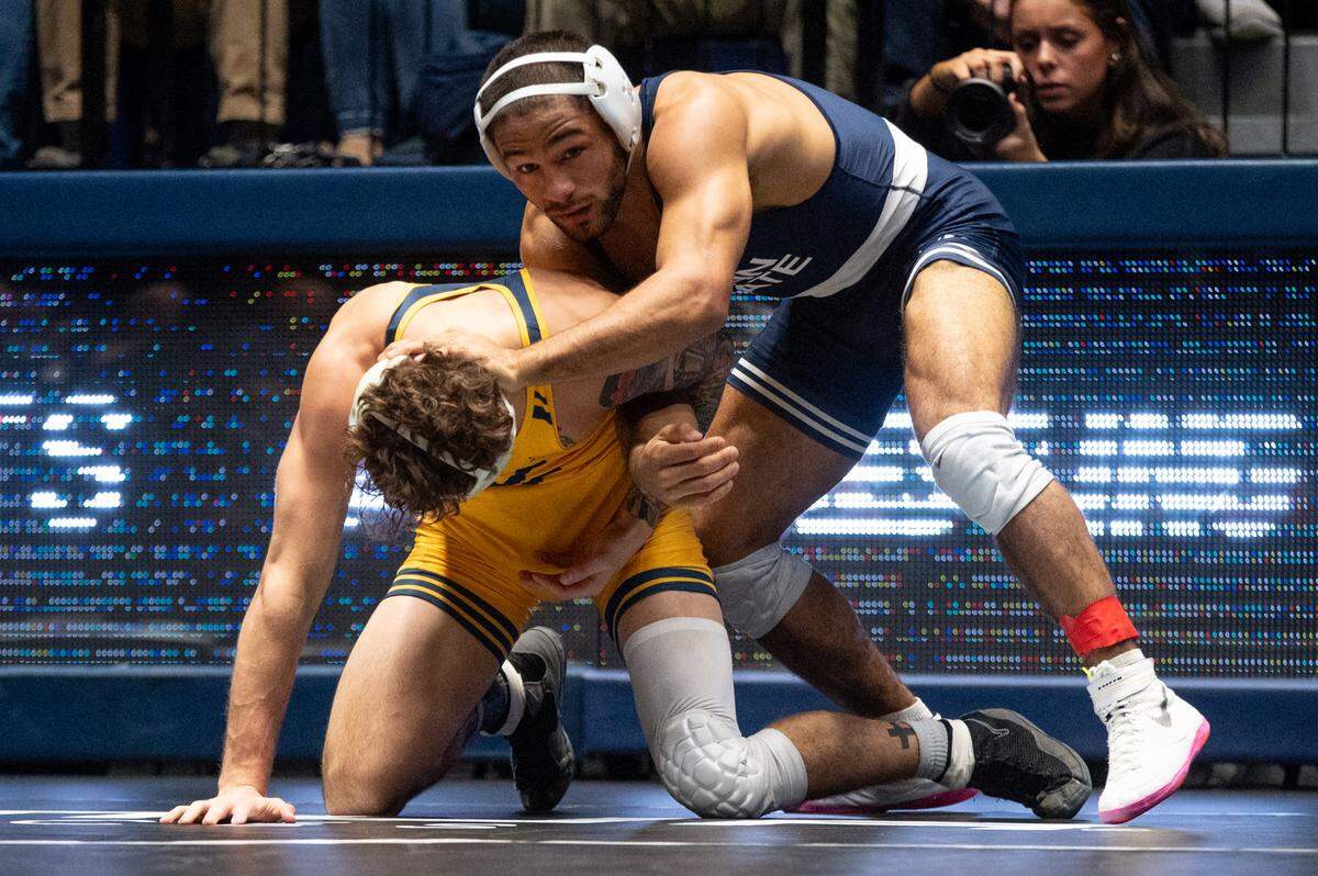 Shayne Van Ness, right, wrestles Ty Watter, left, in a 149-pound bout during the NWCA All-Star Classic at Rec Hall on Saturday, Nov. 16, 2024. Van Ness won the bout 16-4.