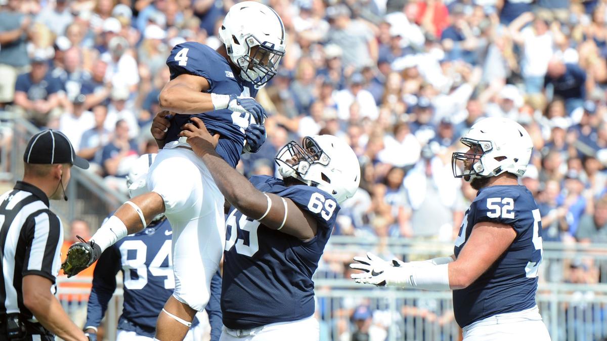 Penn State running back Ricky Slade celebrates scoring a touchdown during a game against Kent State Saturday, Sept. 15, 2018 at Beaver Stadium.
